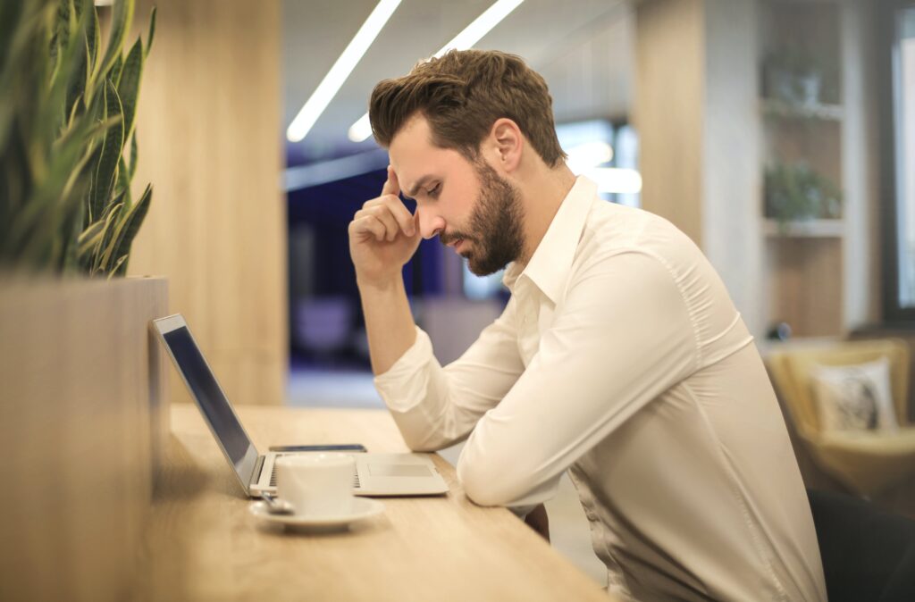 A man sitting and contemplating about the safest mortgage