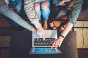 People researching home loans using a laptop